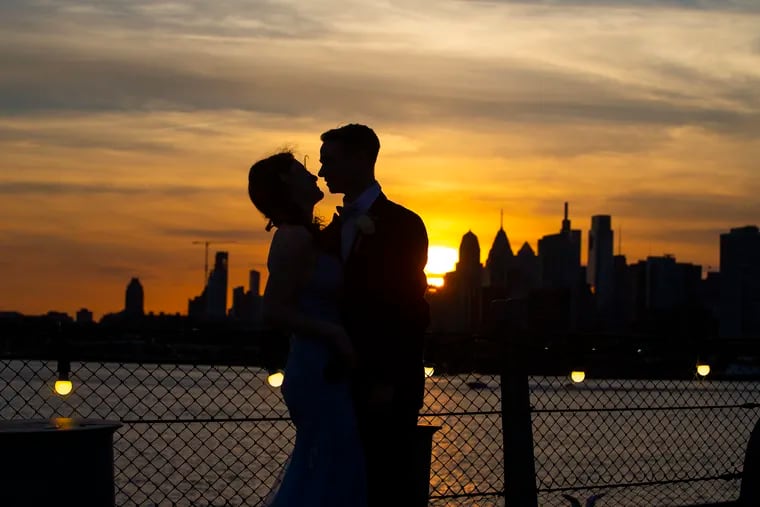 Rachel Raggio, and Eric Mizner have a romantic moment on the deck as the sun sets over Philadelphia. West Deptford High School held its junior-senior prom on the Battleship New Jersey on May 21, 2021.  West Deptford is among several districts holding their prom on the battleship because it offers a huge outdoor space.