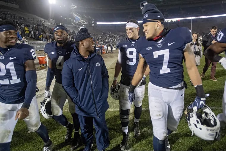 Penn State seniors Amani Oruwariye, Nick Scott, Mark Allen, Trace McSorley and Koa Farmer laugh together as they take a lap around Beaver Stadium after a 38-3 win against Maryland.