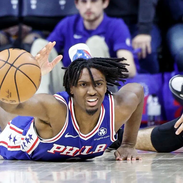 Sixers Tyrese Maxey hits the court with Heat  Caleb Martin during the 4th quarter at the Wells Fargo Center in Philadelphia, Monday, March 18, 2024. Sixers beat the Heat 98-91.