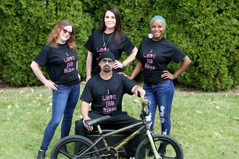 Bobby Toney (front center) poses for a portrait with Michelle Rauscher (left) Jen Schemeley (center) and Jemai Gibson (right) in Audubon, N.J. on September 27, 2020. Toney he fixes old bikes and donates them to kids.