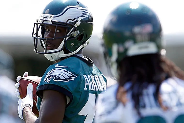Eagles' Nelson Agholor looks back at teammate E.J. Biggers during training camp special teams drills at the NovaCare Complex on Saturday, August 8, 2015.