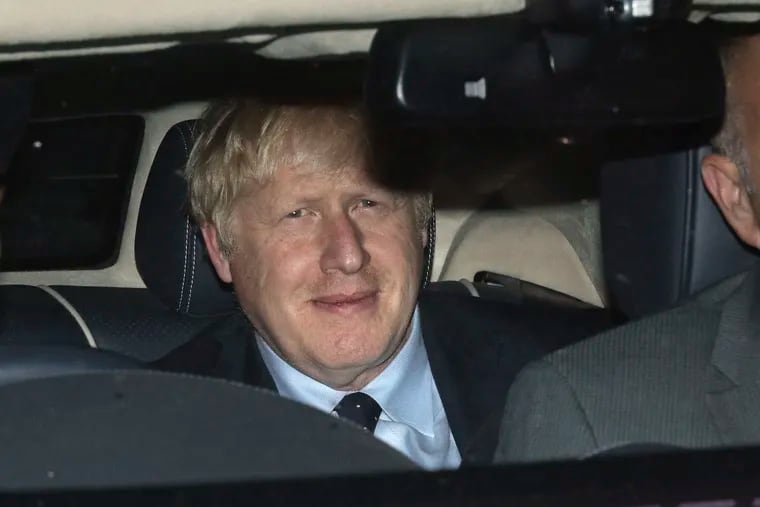 Prime Minister Boris Johnson leaves the House of Commons in London, Tuesday, Sept. 3, 2019, after MPs voted in favor of allowing a cross-party alliance to take control of the Commons agenda on Wednesday in a bid to block a no-deal Brexit on Oct. 31.