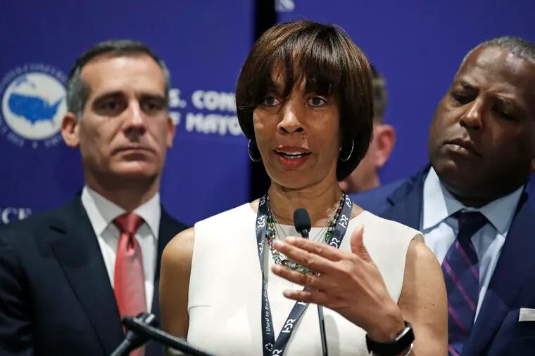 FILE - In this June 8, 2018 file photo, Baltimore Mayor Catherine Pugh addresses a gathering during the annual meeting of the U.S. Conference of Mayors in Boston. Pugh on Monday, March 18, 2019, stepped down from the University of Maryland Medical System’s board of directors, days after it came to light that the hospital network had for years purchased her self-published children’s books. Board positions are unpaid, but The Baltimore Sun reported last week that around a third of the board received compensation through the UMMS network's contracts with their businesses. The newspaper revealed that Pugh failed to fully disclose a $500,000 business relationship she began with the 11-hospital network in 2011.(AP Photo/Charles Krupa, File)