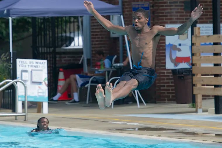 Khalil Brooks, 23, Southwest Philly, prepares to cool off in the Taney Pool, 16th and South Streets., on a hot and humid August 16, 2016.