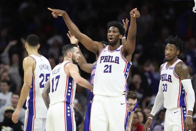 Joel Embiid, center of the Sixers leads the crowd in singing goodbye after Andre Drummond of the Pistons fouled out in the 4th quarter at the Wells Fargo Center on Dec. 2, 2017. CHARLES FOX / Staff Photographer