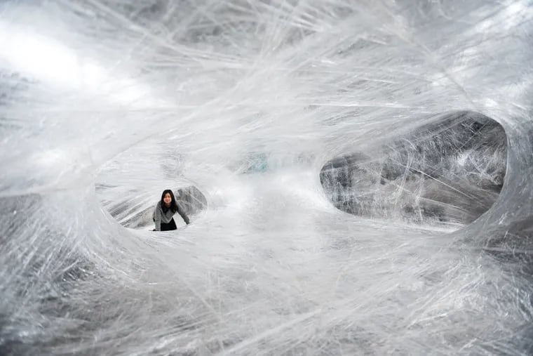 Group X, an all-anonymous group of Philadelphia-based artists, curators, and organizers, has commissioned the experimental European arts collective Numen/For Use to create the tape installation, standing 18 feet up in the air and stretching 50 feet wide.