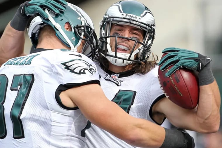 Riley Cooper celebrates his 63-yard second quarter touchdown reception with teammate Brent Celek. (Yong Kim/Staff Photographer)