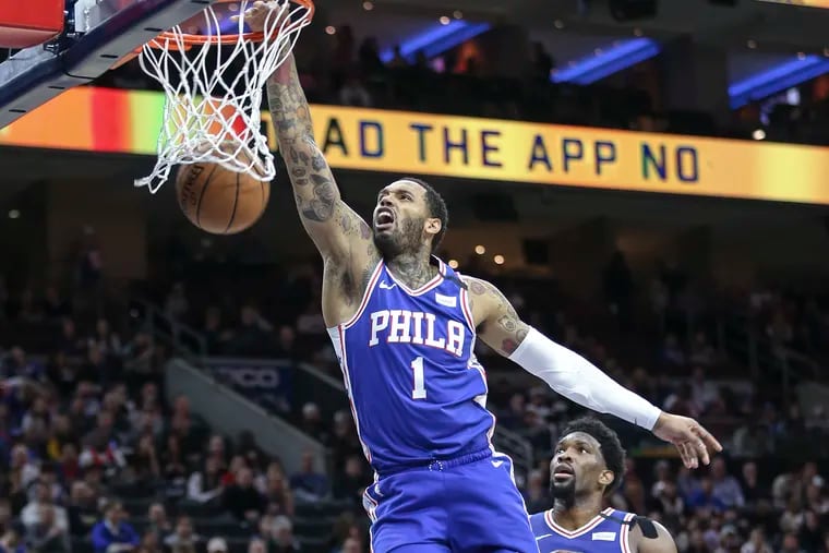 Sixers' Mike Scott dunks against the Pistons during the 1st   quarter at the Wells Fargo Center in Philadelphia, Wednesday, March 11, 2020.