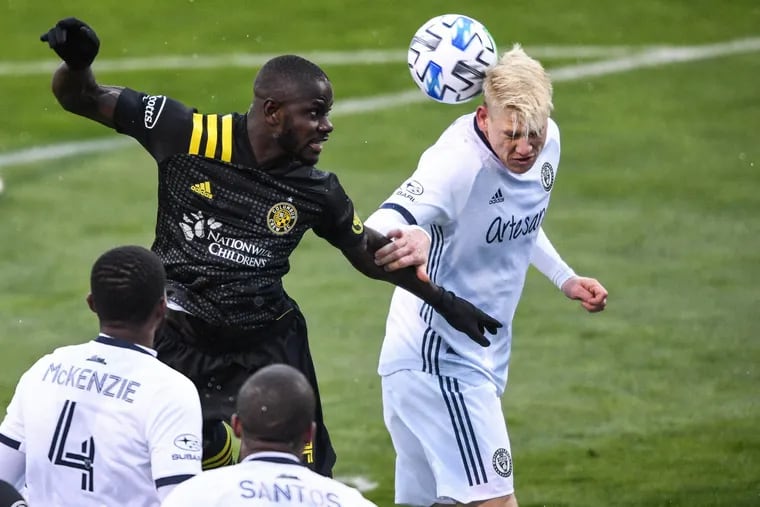 Jakob Glesnes, right, goes up for a header next to Jonathan Mensah during the Union's game at Columbus on Sunday.