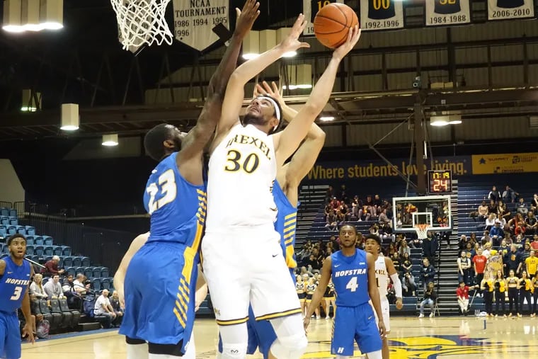 Drexel's Alihan Demir goes up strong and scores inside during the second half against Hofstra