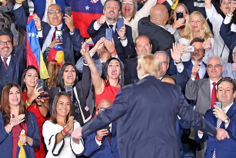Supporters yell for U.S. President Donald Trump after he gave a speech on Venezuela at the FIU-Ocean Bank Convocation Center Monday, Feb. 18, 2019 in Miami, Fla. (Charles Trainor Jr./Miami Herald/TNS)
