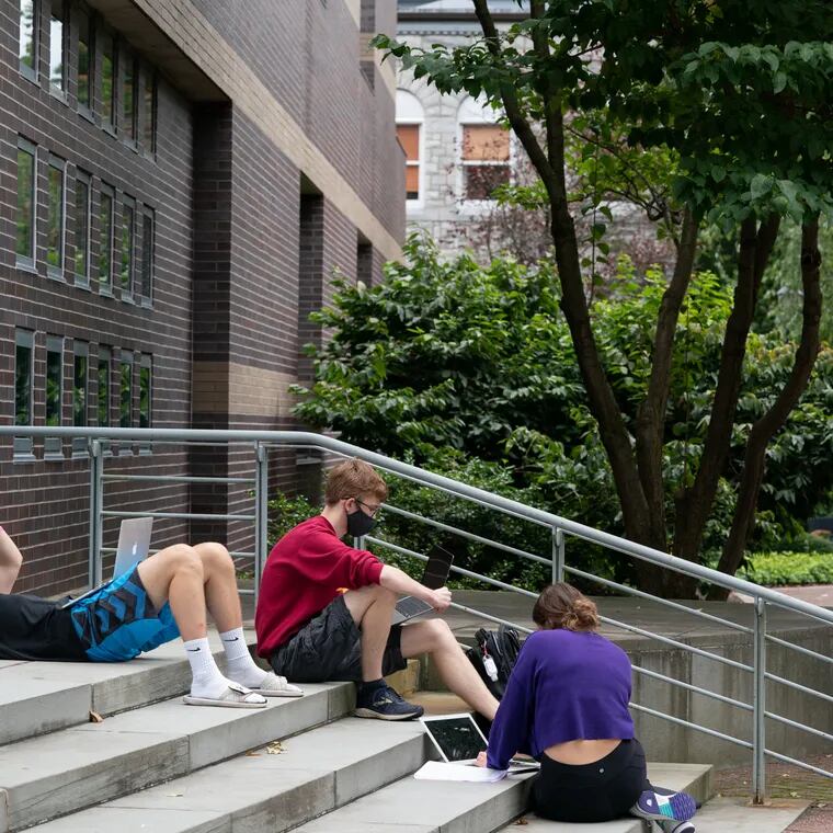 In this 2020 photo, Ursinus College students (left to right) Dylan Crammer, Nick Pickar, and Shay Henes do group work during a break in class.