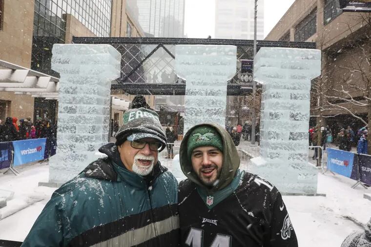 Paul Villari, left, and his son Alex Villari, right, Eagles fans from Cinnaminson, New Jersey, at Super Bowl Live on Nicollet Mall, in Minneapolis, Minnesota, Saturday, Feb. 3, 2018. Paul’s father was a ticket holder for 70 years, and attended the first NFL championship in 1948, at Shive Park. Paul and Alex won Super Bowl tickets through the season ticket holder lottery.