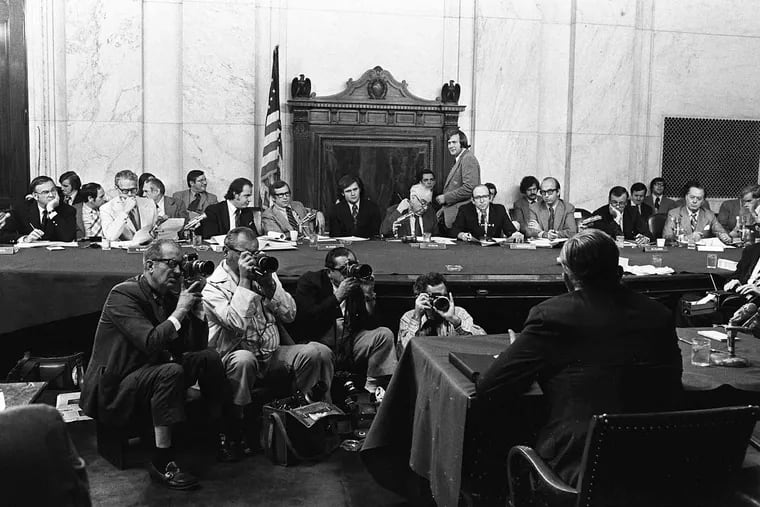 In this Aug. 3, 1973, file photo, the Senate Watergate Committee hearings continue on Capitol Hill in Washington. From left are: Sen. Lowell P. Weicker, Jr; Sen. Edward J. Gurney, Fred Thompson, Sen. Howard H. Baker, Jr; Rufus Edmisten, Sen. Sam Ervin; Sam Dash, Sen. Joseph M. Montoya, Sen. Daniel K. Inouye was absent. Testifying is Lt. Gen. Vernon Walters.