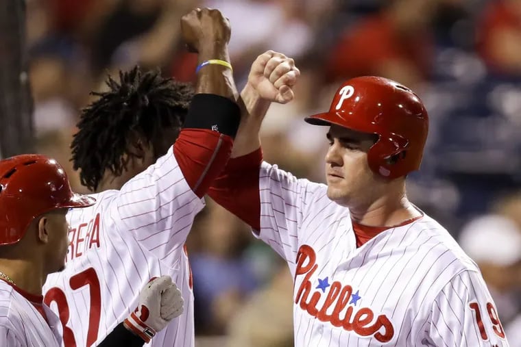 Phillies first baseman Tommy Joseph celebrates his second-inning run Wednesday with teammate Odubel Herrera against the Los Angeles Dodgers.