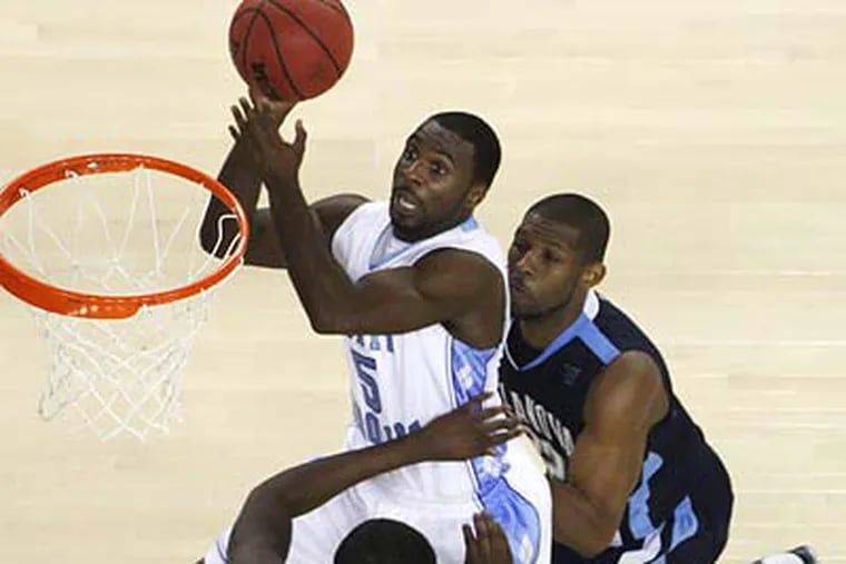 Some mock drafts project UNC guard Ty Lawson as the Sixers' pick at the 17th spot in the first round. (Paul Sancya/AP file photo)