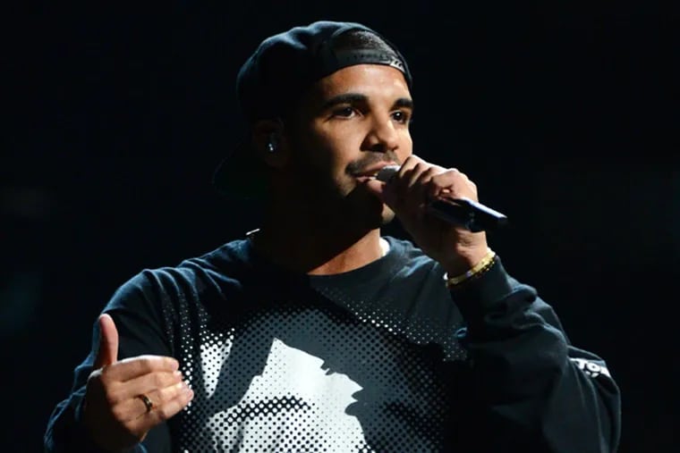 This Sept. 21, 2013 file photo shows Drake performing at the iHeartRadio Music Festival in Las Vegas, Nev. Drake's latest album, "Nothing Was The Same," was released on Tuesday, Sept. 24. (Photo by Al Powers/Powers Imagery/Invision /AP, File)