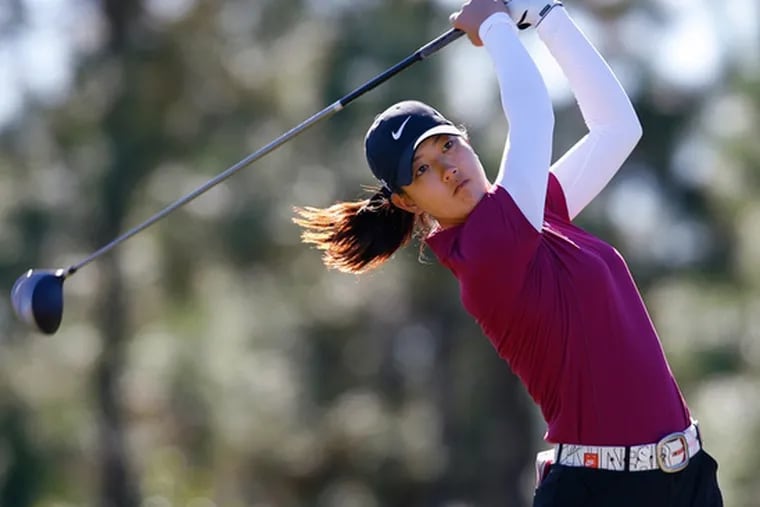 Michelle Wie follows her drive off the 16th tee during LPGA qualifying in Daytona Beach, Fla.