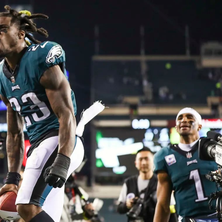 Eagles safety C.J. Gardner-Johnson (23) and quarterback Jalen Hurts walk off together after a 26-17 win over the Dallas Cowboys at Lincoln Financial Field in 2022.