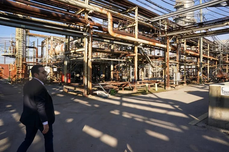 Roberto Perez, the chief executive of HRP, walks through the former PES refinery in South Philadelphia that his company is redeveloping into a mixed-use facility called The Bellwether District.