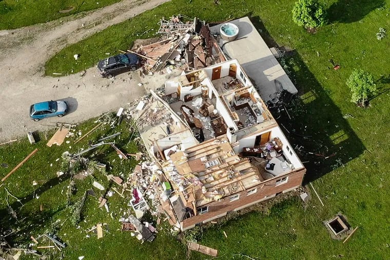 Storm damaged homes remain after a tornado passed through the area the previous evening, Tuesday, May 28, 2019, in Brookville, Ohio.