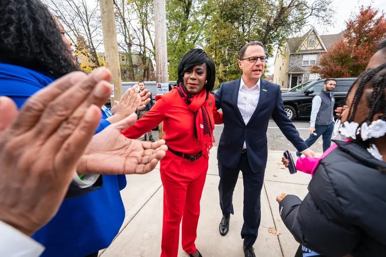Mayoral candidate Cherelle Parker, left, and Gov. Josh Shapiro, right, at Pinn Memorial Baptist Church, in Philadelphia on Tuesday. Shapiro made an Election Day campaign stop with Parker.