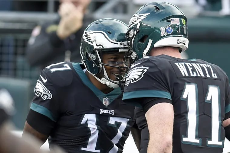 Alshon Jeffery and Carson Wentz celebrate a touchdown in a November game. You can win tickets to an Eagles game through the Philadelphia Youth Sports Collaborative.