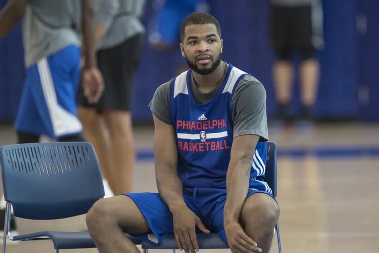 Aaron Harrison takes a breather during a rest period on the first day of rookie camp with the Sixers.