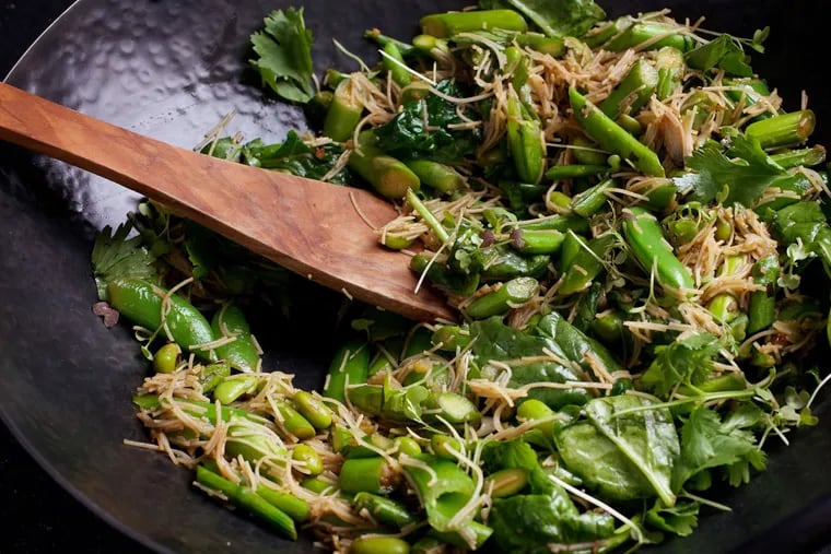 Super green stir-fry, a bounty of sugar snap peas, edamame, asparagus by the inch, spinach, and scallions with a gingery, spicy sauce is a satisfying, guilt-free dish.