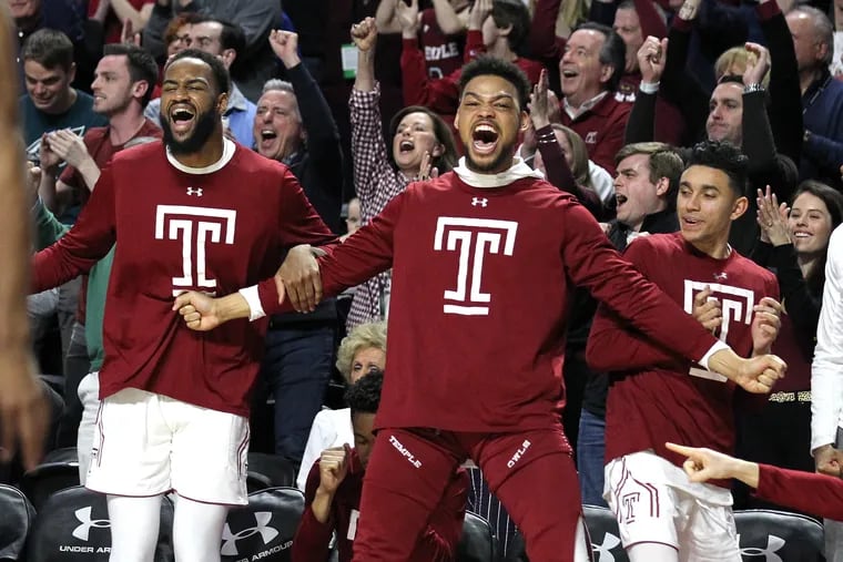 The Temple bench celebrates after a Quinton Rose dunk against Central Florida at the Liacouras Center on March 9, 2019.