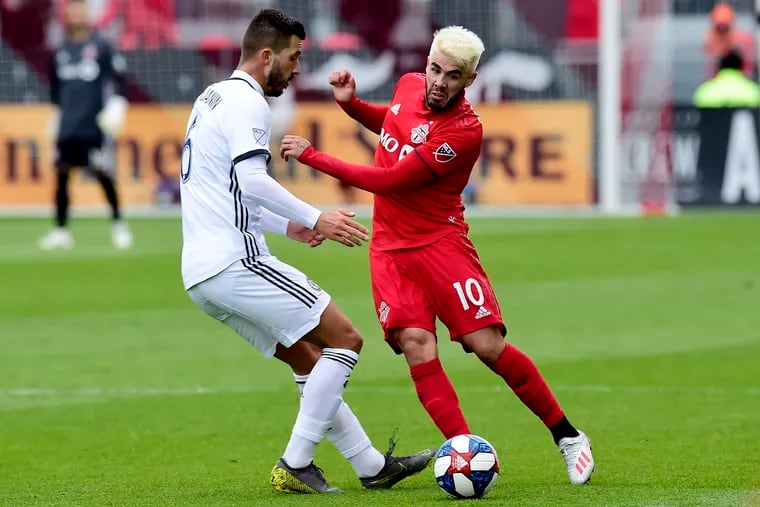 Philadelphia Union midfielder Haris Medunjanin battles for the ball against Toronto FC midfielder Alejandro Pozuelo.