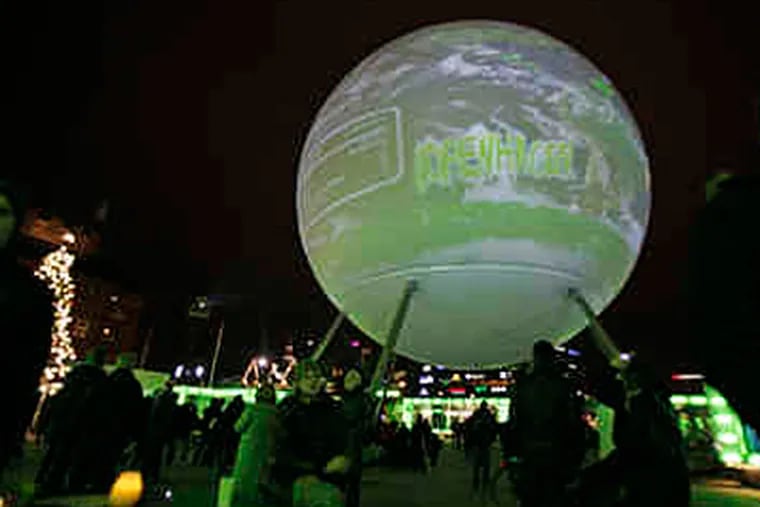 Opening day of the international conference on climate change in Copenhagen, Denmark, made for a global scene in Town Hall Square. (PETER DEJONG / Associated Press)