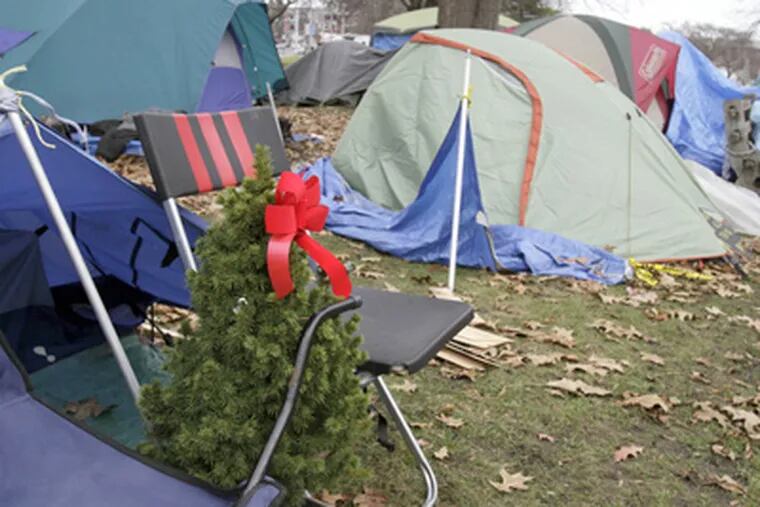 An Occupy encampment in Portland, Maine, reflects the angst of the economic climate and the hope of the season. (Pat Wellenbach / Associated Press)