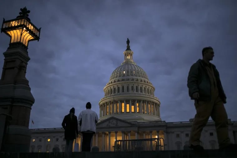 In this Jan. 21, 2018, file photo, lights illuminate the U.S. Capitol on second day of the federal shutdown as lawmakers negotiate behind closed doors in Washington.