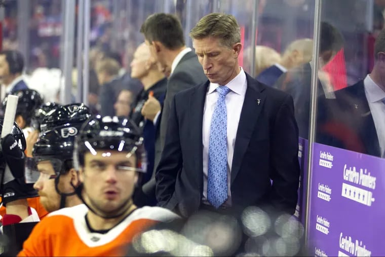 Philadelphia Flyers head coach Dave Hakstol behind the bench in a file image. On Friday, Dec. 14, 2018, the Flyers dropped a 4-1 decision against the visiting Edmonton Oilers. (Charles Fox/Philadelphia Inquirer/TNS)