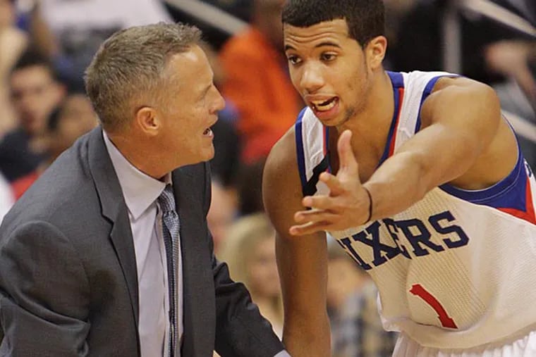 Sixers head coach Brett Brown talks with Michael Carter-Williams while
playing the Wizards during the second quarter.  (Steven M. Falk/Staff Photographer )