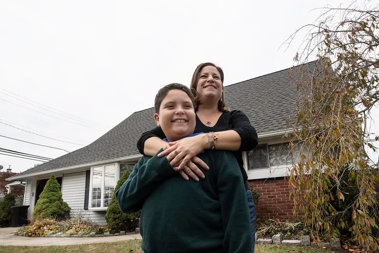 Melissa Centifonti and her 9-year-old son Ethan in front of their home in Langhorne, Bucks County. Centifonti, a real estate agent, went through Bucks County's first-time homebuyer program to buy her home in 2017.