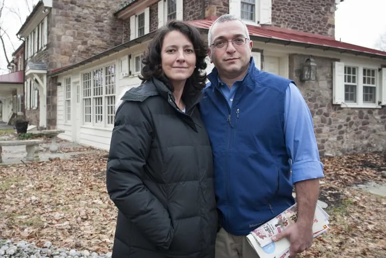 Dr. Amy Reed and her husband, Dr. Hooman Noorchash, in front of their home on Feb. 4, 2016. Her family is seeking to have her body buried in Washington Crossing National Cemetery.