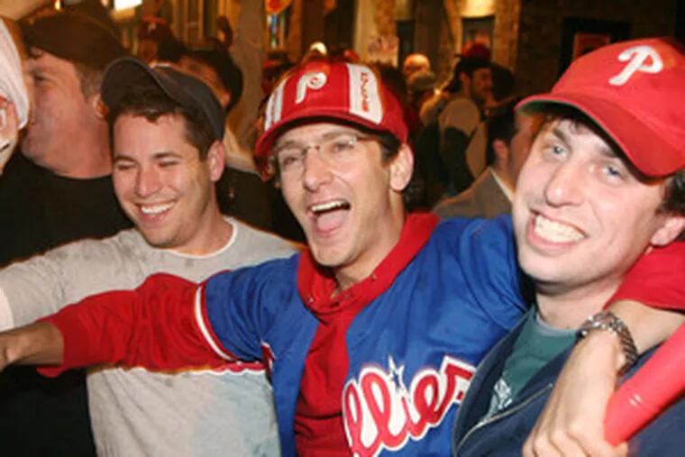 Fans celebrate on South Street after the Phillies win the World Series.