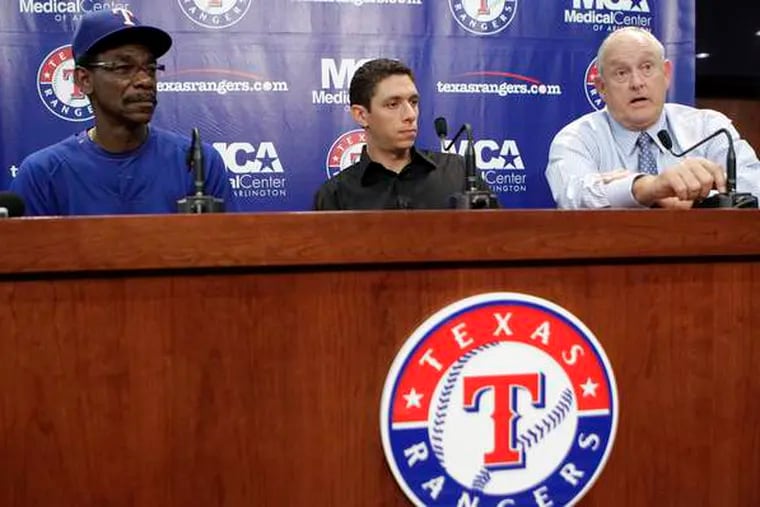 Texas manager Ron Washington (left), GM Jon Daniels, president Nolan Ryan discuss Cliff Lee trade.