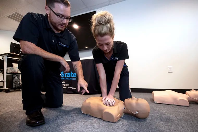As CEO of Tri-State Training & Safety Consulting in Folsom, Kevin Kerns, instructing marketing associate Sarah Gibbons on proper CPR technique, knows well the challenges of hiring, made tougher at a time of near-historic low unemployment.
