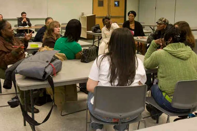 Parolees taking part in the Female Offender Resource Group of Essex talk about their lives at a program session.