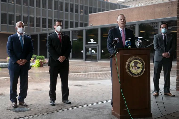 U.S. Attorney William M. McSwain speaks at the podium outside the James A. Byrne Federal Courthouse in Center City, Philadelphia on Thursday, Aug. 13, 2020, after Jovaun Patterson's sentencing hearing. At left is Assistant U.S. Attorney Salvatore Astolfi; John Schmidt, acting special agent in charge of the ATF's Philadelphia Field Division; and Tom Malone (right), an attorney who has been helping victim Mike Poeng.