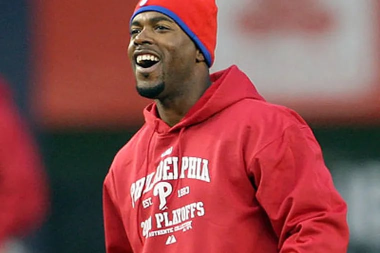 Jimmy Rollins' extension makes him a member of the Phillies through 2011. (Yong Kim/Staff Photographer)
