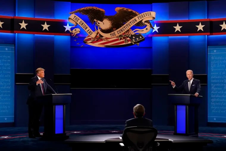 President Donald Trump, left, and Democratic presidential candidate former Vice President Joe Biden, right, with moderator Chris Wallace, center, of Fox News during the first presidential debate Tuesday, Sept. 29, 2020, at Case Western University and Cleveland Clinic, in Cleveland, Ohio.