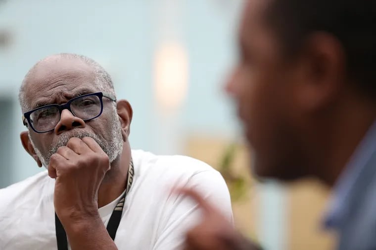 Albert Dukes, 66, who is one of the resident leaders at the Nellie Reynolds apartments, listens as Atif Bostic, executive director of Uplift Solutions, talks about a Lyft program to help seniors with trips to the grocery store in Philadelphia, PA on August 14, 2019.
