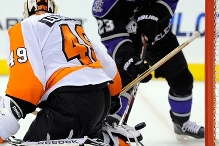 Michael Leighton picked up a win in his first start of the season.  (AP Photo/Mark J. Terrill)