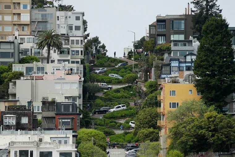 Cars wind their way down Lombard Street in San Francisco, Monday, April 15, 2019. Thousands of tourists may soon have to pay as much as $10 to drive down the world-famous crooked street if a proposal to establish a toll and reservation system becomes law.