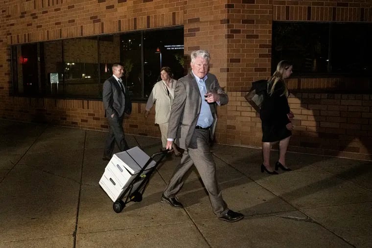 Former labor leader John Dougherty, and his nephew, Greg Fiocca, left, leave the federal courthouse in Reading with family on Thursday, after a judge declared a mistrial in their extortion case.
