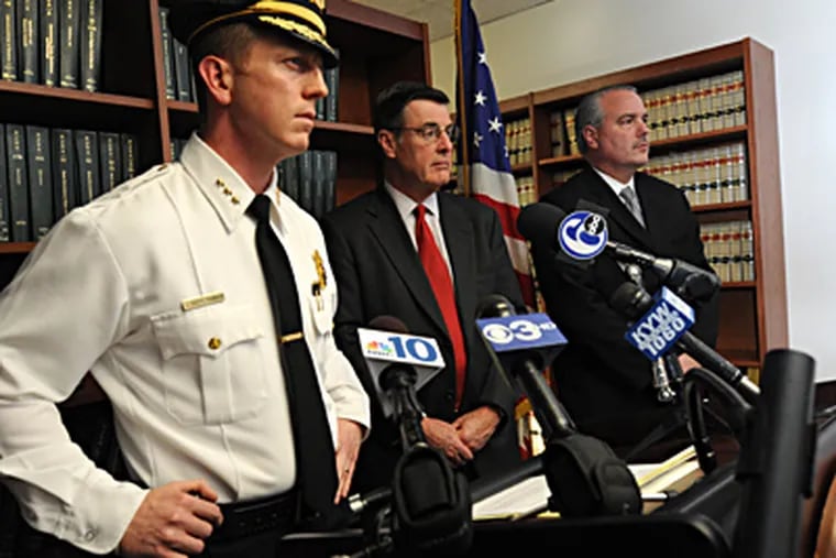 Announcing the arrest Thursday of Kevin D. Cleveland, 19, are (from left) Camden Police Chief Scott Thomson, Camden County Prosecutor Warren W. Faulk, and FBI Supervisory Special Agent Jeffrey Walker. (April Saul / Staff Photographer)